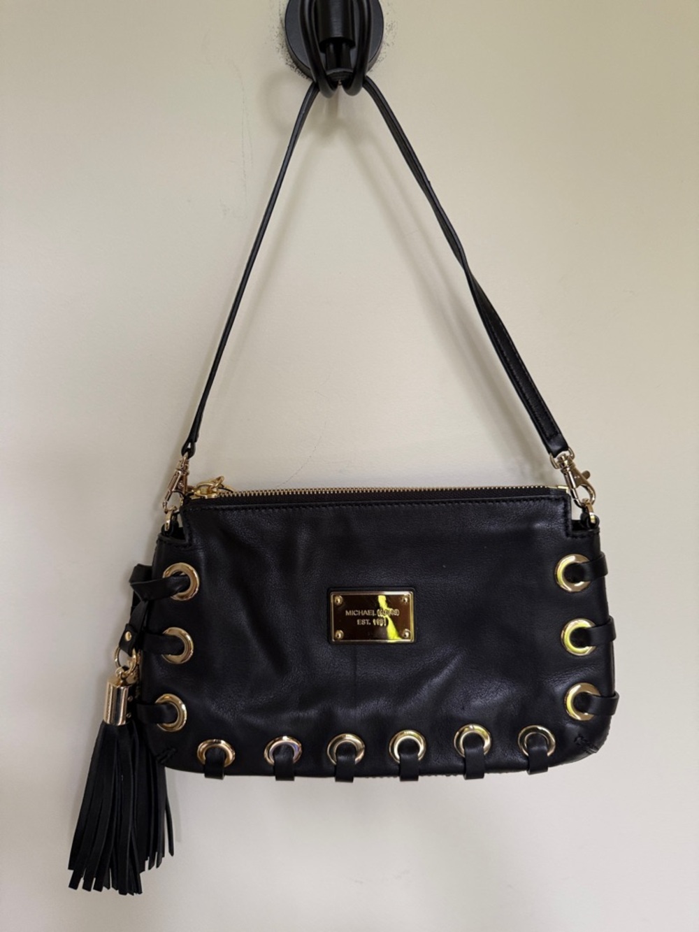 Michael Kors Black Leather Shoulder Bag with Gold Accents and Tassel